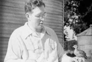 Donald MacFarlane Holding Pheasant in 1949