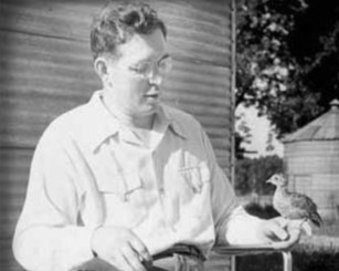 Donald MacFarlane Holding Pheasant in 1949